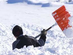 Person shoveling deep snow