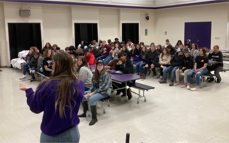 students listening to an adult